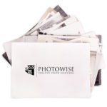 pile of photos going to photowise to be organized and scanned